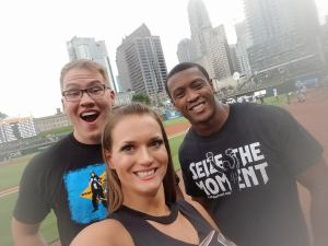 Caprice Coleman of Ring of Honor, Kelly Klein of Women of Honor, and Ian Riccaboni, ROH Broadcaster, stand outside the dugout before throwing out the first pitch at the Charlotte Knights game!